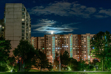 View of Moscow on the pond at moonlight night in Yasenevo district © vasvormich
