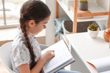 Little girl studying at home