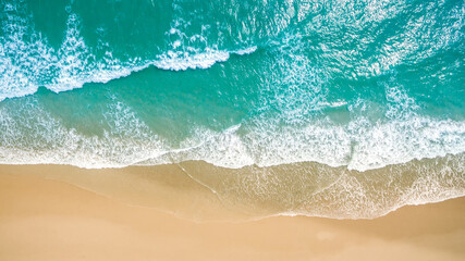 Fototapeta na wymiar Top view aerial image from drone of an stunning beautiful sea landscape beach with turquoise water with copy space for your text. Beautiful Sand beach with turquoise water, aerial UAV drone shot