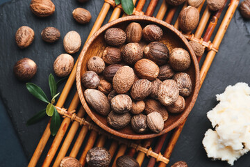 Bowl of shea nuts on table
