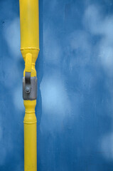 gas pipe with faucet on wall background