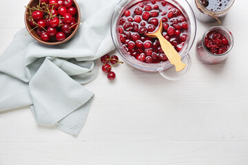 Composition with tasty cherry jam on light wooden background