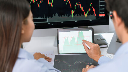 Financial concept a couple of stock traders thinking of strategy of investment to gain the highest profit.