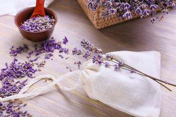 Composition with lavender flowers on light wooden background
