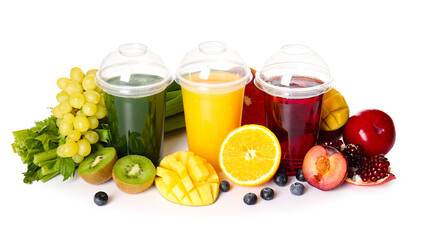 Plastic cups with healthy juice, fruits and vegetables on white background