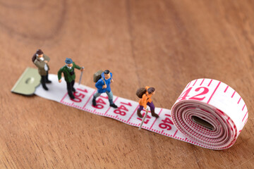 Miniature creative group hiking exercise