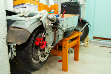 disassembled electric scooter pulled out battery