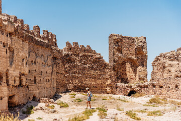 Tourist visiting the walls of a medieval castle