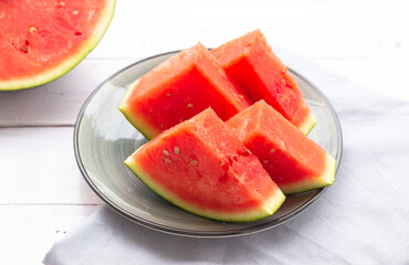Watermelon slices on a plate, close up. Watermelon without black seeds.