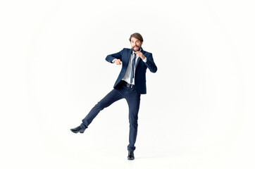 Fototapeta na wymiar a man in a jacket and tie movement Jump office Studio