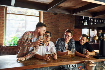 Facial expression. People in casual clothes sitting in the pub