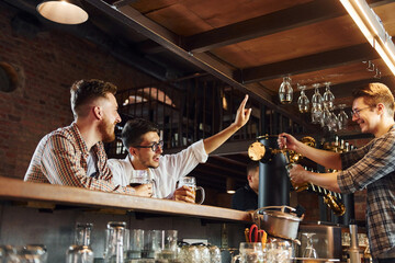 Facial expression. People in casual clothes sitting in the pub