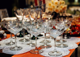 Raw of crystal wine glasses. Luxury table setting. Selective focus