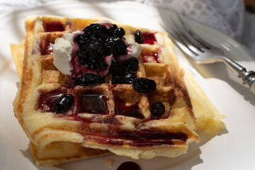 Close-up of waffles on the white plate