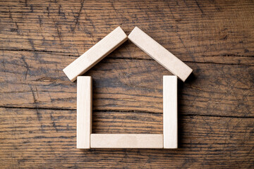 Obraz na płótnie Canvas house or home symbol made by wooden blocks. estate service concept