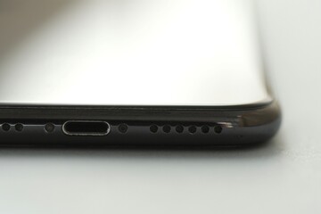 Closeup macro of the bottom of mobile smart phone