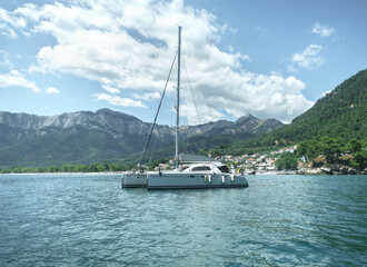 Majestic view at sailing catamaran boating in sea.