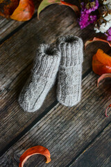 Small handmade baby socks, made of organic sheep wool yarn