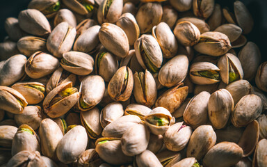 Close up pistachios scattered. Ready to eat nuts. Energy food. 