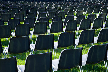 rows of empty chairs on the lawn abroad for entertainment