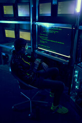 Obraz na płótnie Canvas Cyber hacker breaks into databases to obtain information using a computer.