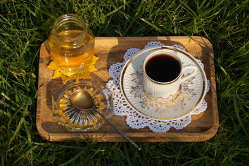 bottle with honey and flowers