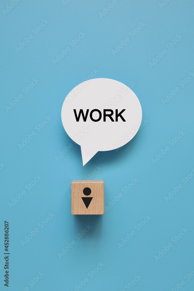 Poster a wooden cube with the image of a person and the word work on it. a symbol of a man's reflection on 