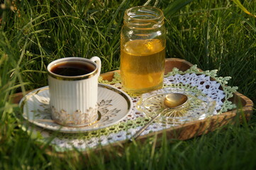bottle with honey and flowers