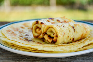 Bakery. Home made pancakes with   organic free range  eggs and white cheese on wooden background. Rustic style breakfast