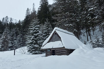 Small cottage in winter valley Tatra mountains, Poland