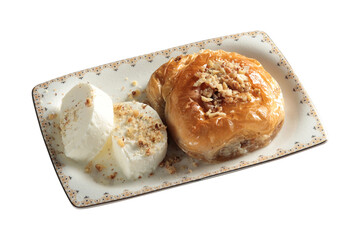 Turkish dessert with walnuts. (Sac Arasi) Vanilla ice cream.