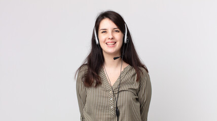 pretty woman looking happy and pleasantly surprised. assistant agent with a headset
