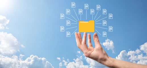 Document Management System DMS .Businessman hold folder and document icon.Software for archiving,...