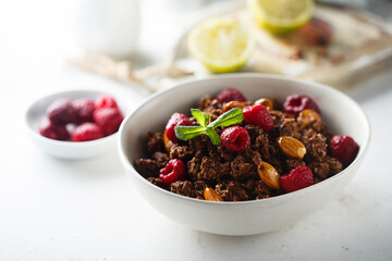 Homemade chocolate granola with raspberry