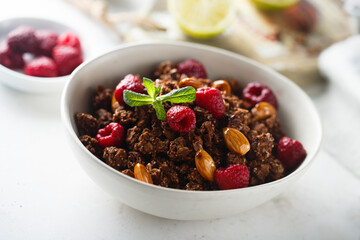 Homemade chocolate granola with raspberry