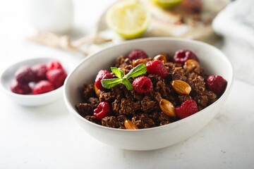 Homemade chocolate granola with raspberry