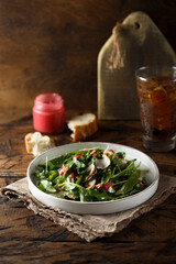 Healthy green salad with cranberry dressing