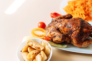 Freshly grilled chicken with vegetables and carrot salad