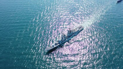 Aerial view of naval ship, battle ship, warship, Military ship resilient and armed with weapon systems, though armament on troop transports. support navy ship. Military sea transport.
