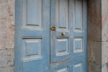 blue wooden door in stone house