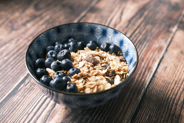  cereal breakfast and blue berry in bowl on table 