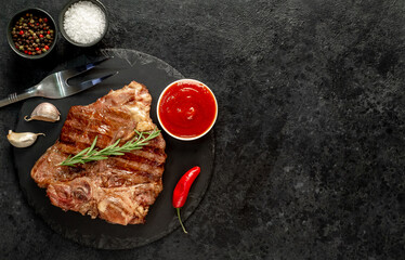 grilled T-bone steak on a stone background  with copy space for your text