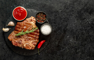 grilled T-bone steak on a stone background  with copy space for your text