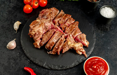 grilled T-bone steak on a stone background