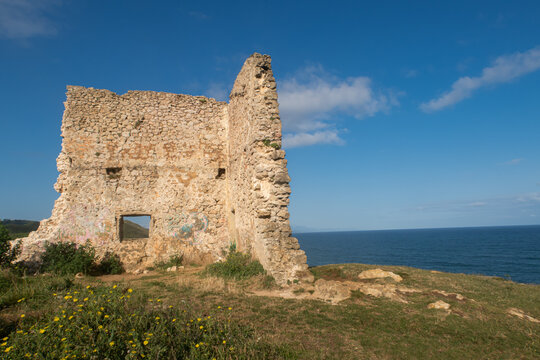 ruined tower of the tagle beach in cantabria