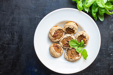 stuffed mushroom mushrooms stuffed baked no meat fresh portion ready to eat meal snack on the table copy space food background rustic. top view keto or paleo diet veggie vegan or vegetarian food