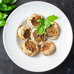 stuffed mushroom mushrooms stuffed baked no meat fresh portion ready to eat meal snack on the table copy space food background rustic. top view keto or paleo diet veggie vegan or vegetarian food