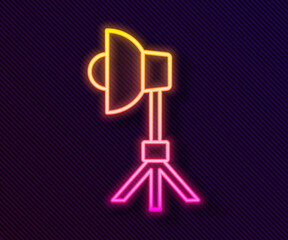 Glowing neon line Studio light bulb in softbox icon isolated on black background. Shadow reflection design. Vector