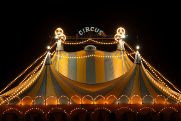 Circus tent at night with its colorful lights on - obrazy, fototapety, plakaty
