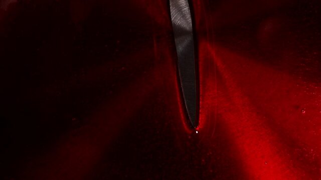 Red syrup fills the stewpan. Dessert making process. High quality FullHD footage